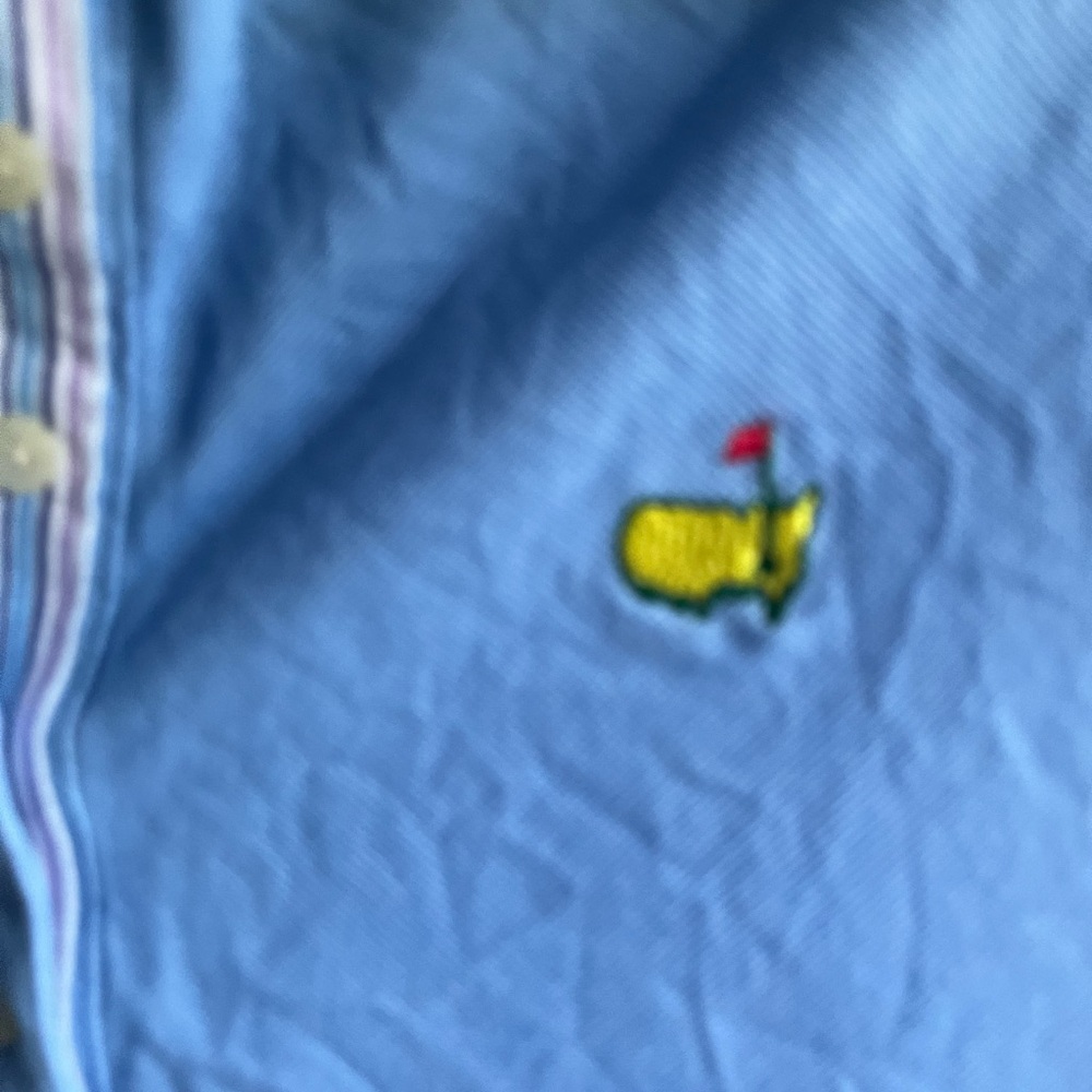 Master’sBlue Sleeveless Polo Shirt with Embroidered Master’s Logo medium